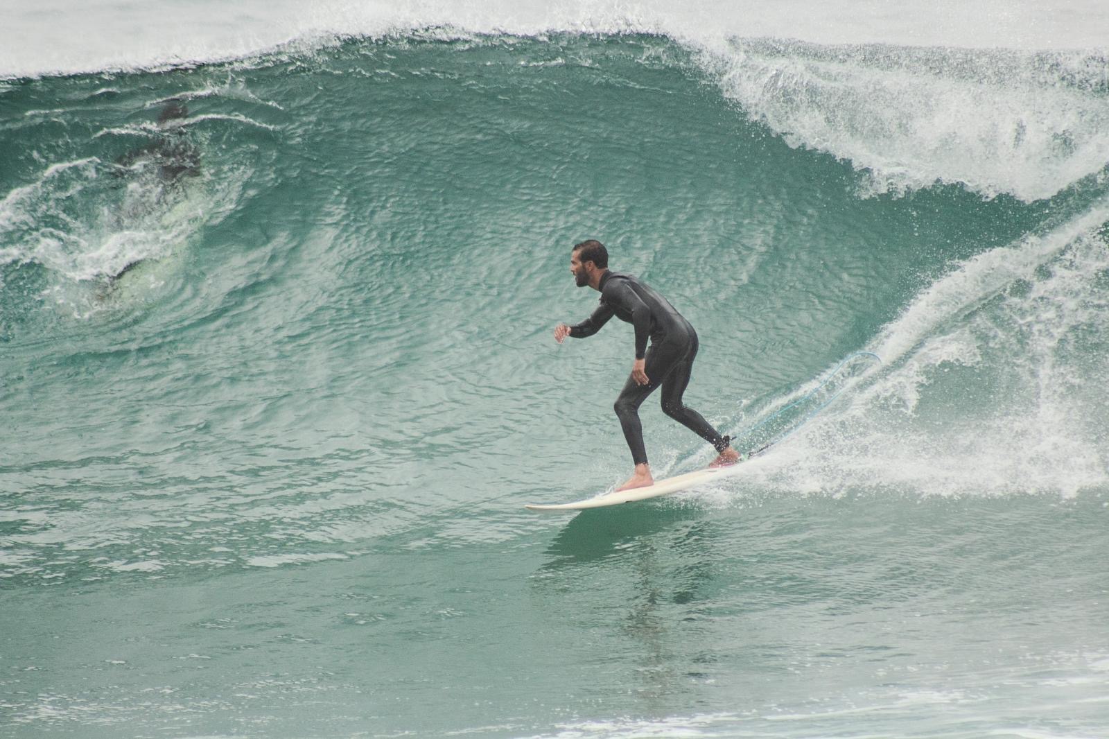 Zeri riding a large green wave